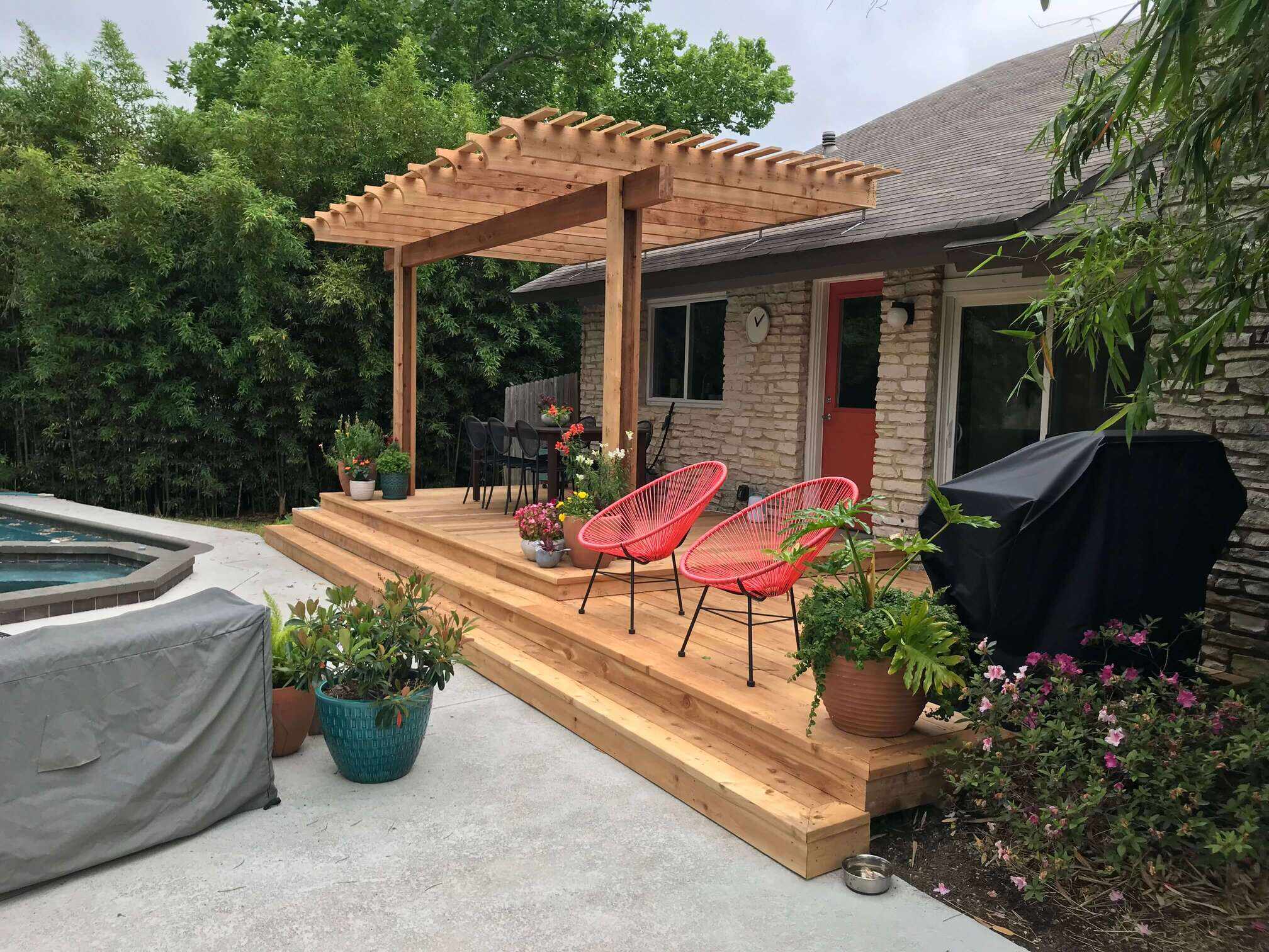 Custom wood deck with pergola and outdoor seating