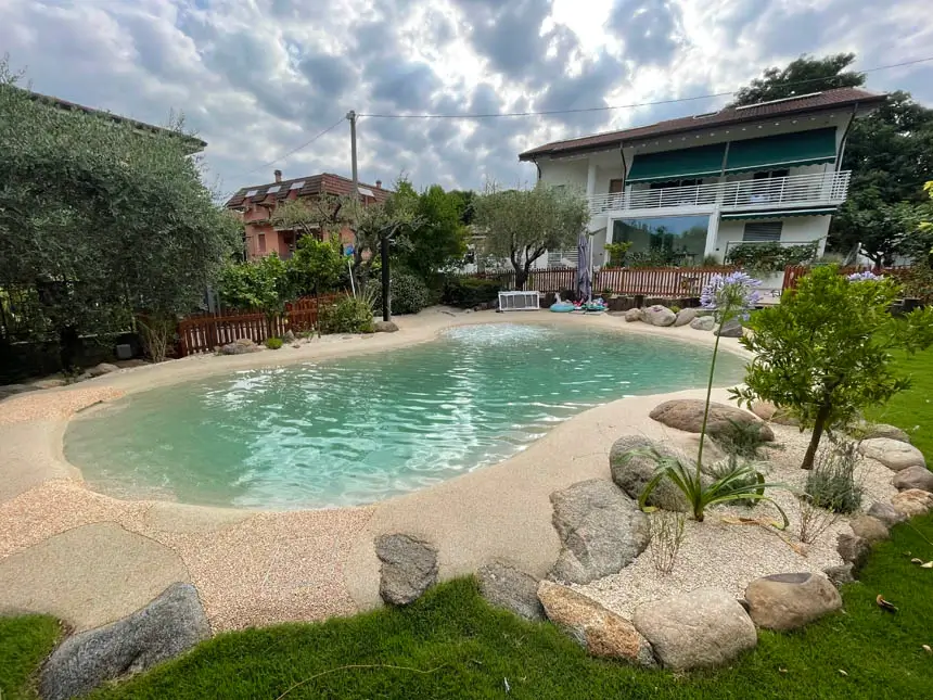 Lagoon pool with natural landscaping and boulder features