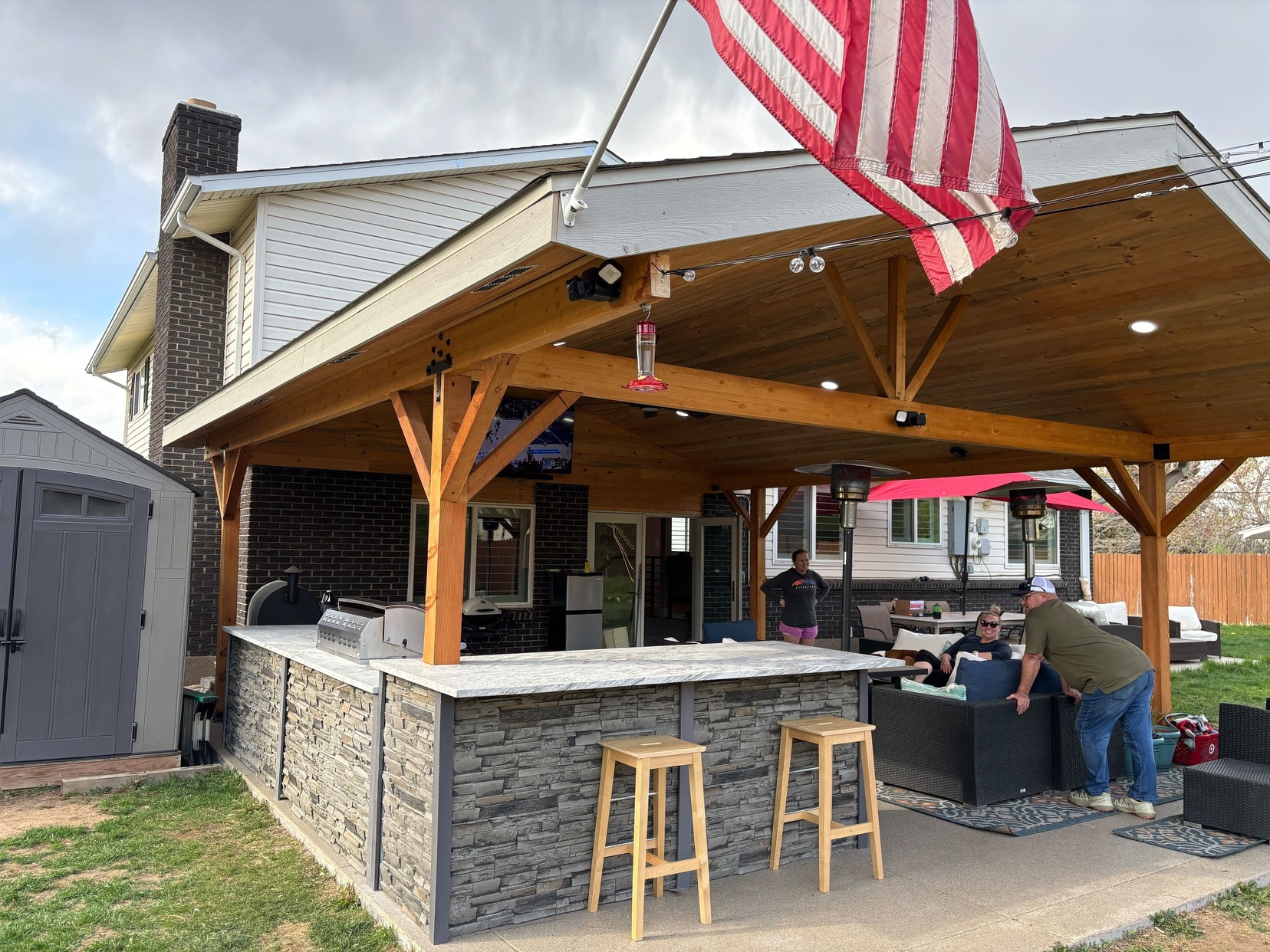 Pavilion with outdoor kitchen bar and stone island